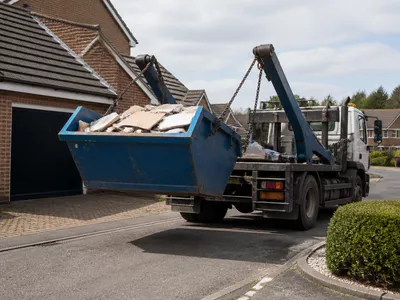 Skip being collected from a property in Stanground