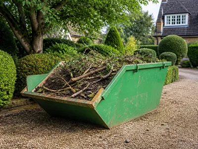Midi skip filled with garden waste in Yaxley